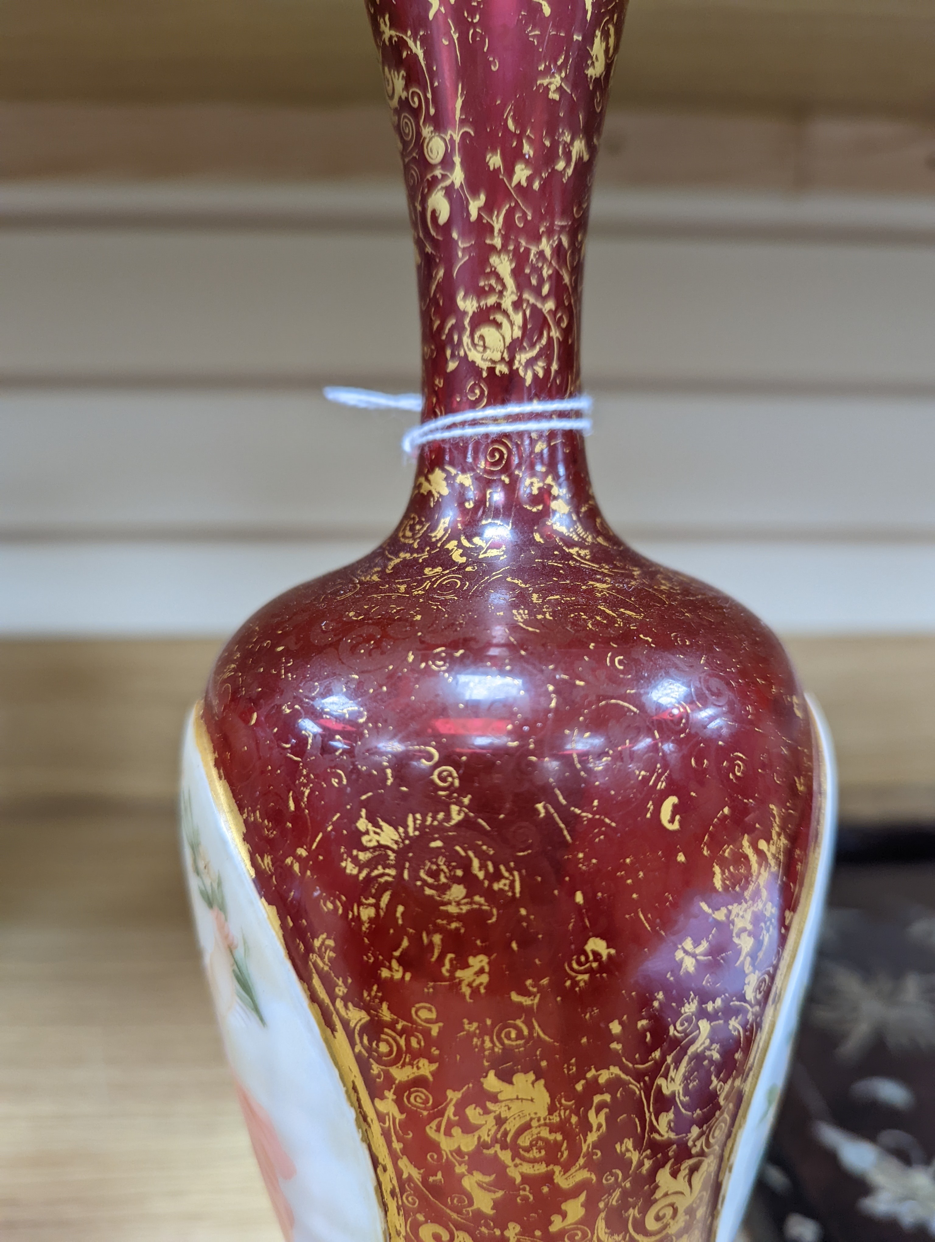 A pair of 19th century Bohemian enamelled and overlaid ruby glass vases 36cm